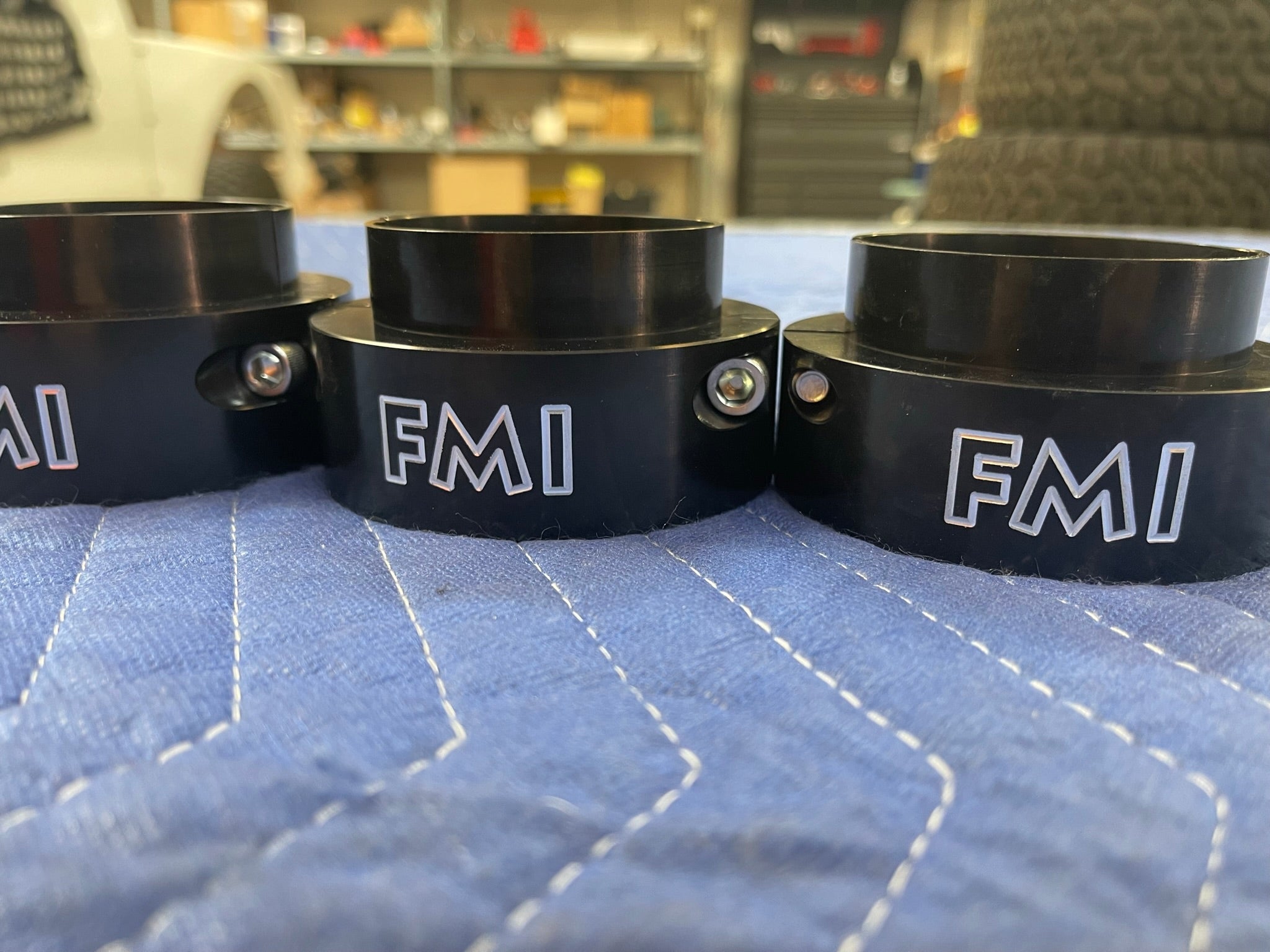 2021-2024 Ram TRX 2-inch front leveling kit components showcasing durable black spacers with FMI branding.