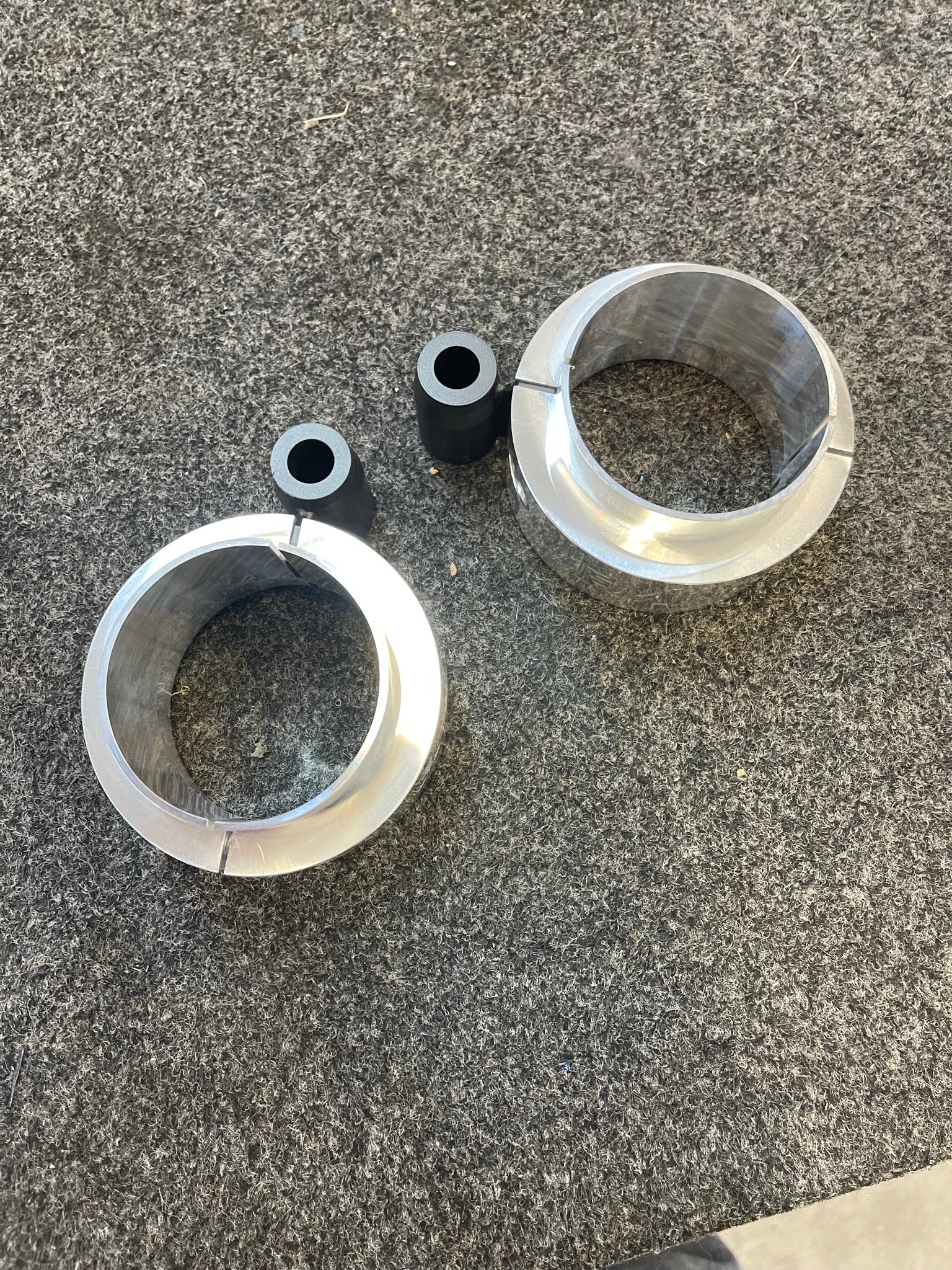2021-2024 Ram TRX 1.5-inch front leveling kit components including aluminum spacers and rubber bushings.