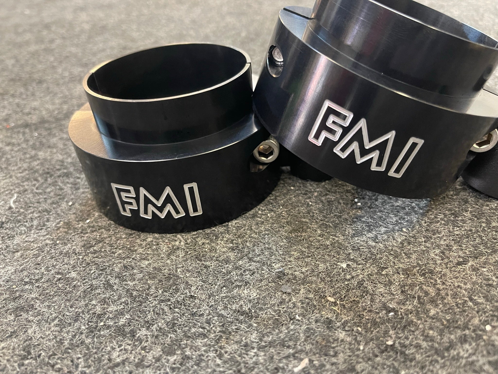 2025 Ram RHO 1.5 inch front leveling kit components showcasing durable black aluminum construction with FMI branding.