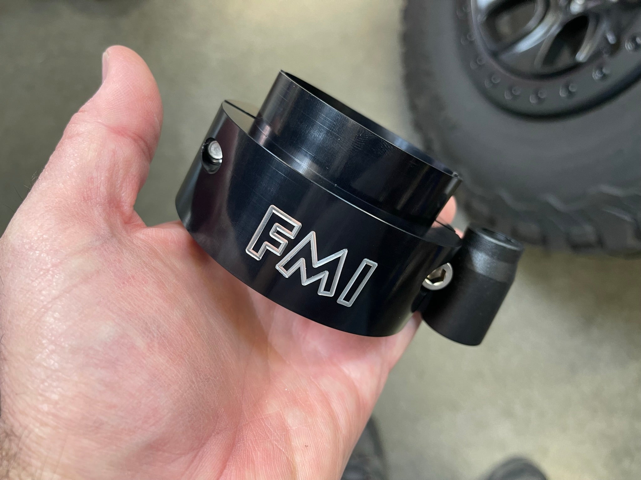 2025 Ram RHO 1.5 inch front leveling kit held in hand, showcasing its durable design for enhanced vehicle performance.