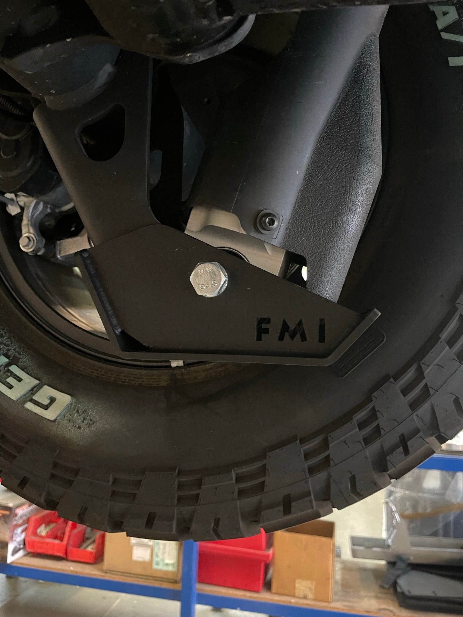 2025 Ram RHO Rear Shock Skid Kit installed on a truck, showcasing durable metal construction and protective design.