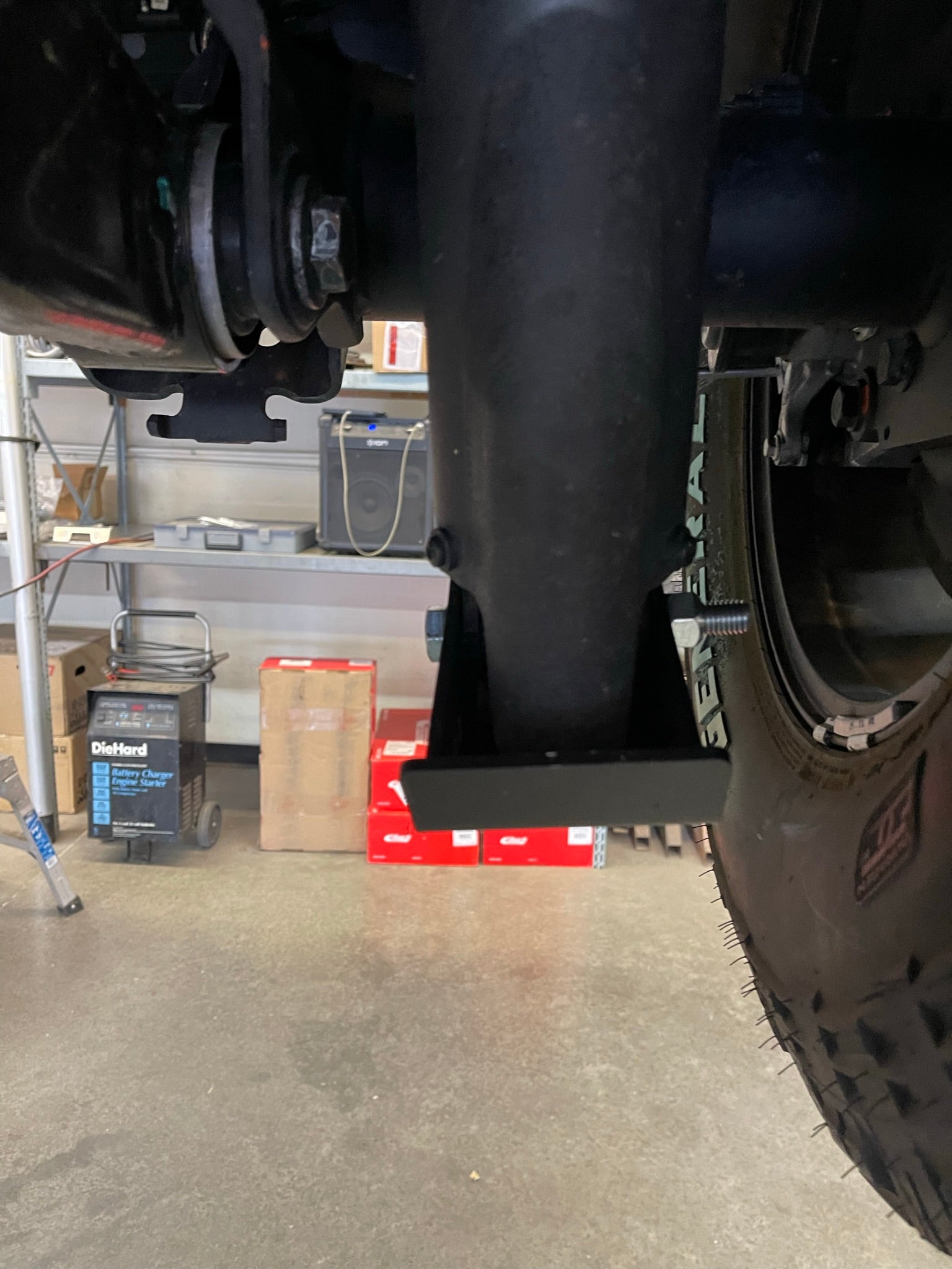 2025 Ram RHO Rear Shock Skid Kit installed under a truck, showcasing its protective design and sturdy construction.