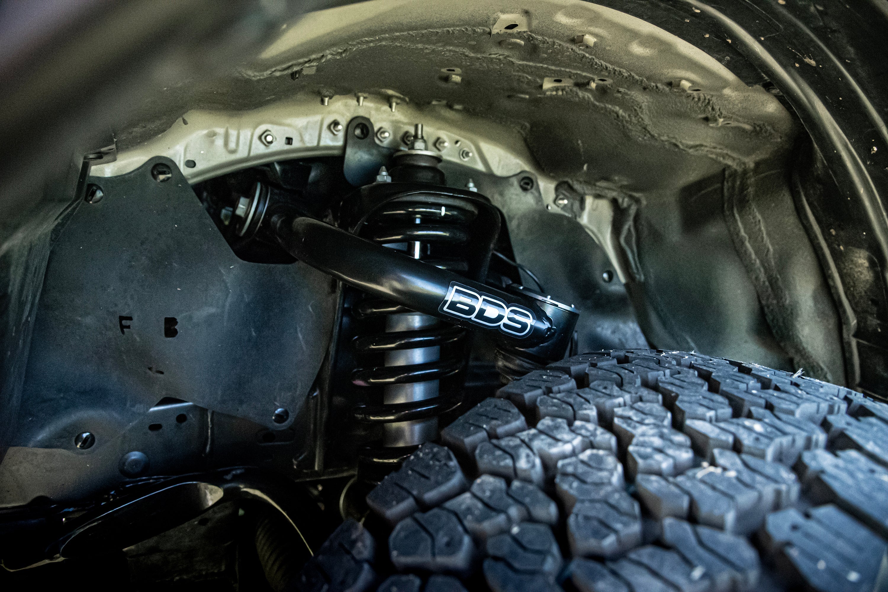 2-inch lift kit featuring FOX coil-overs installed on a Toyota Hilux, showcasing enhanced suspension and tire clearance.