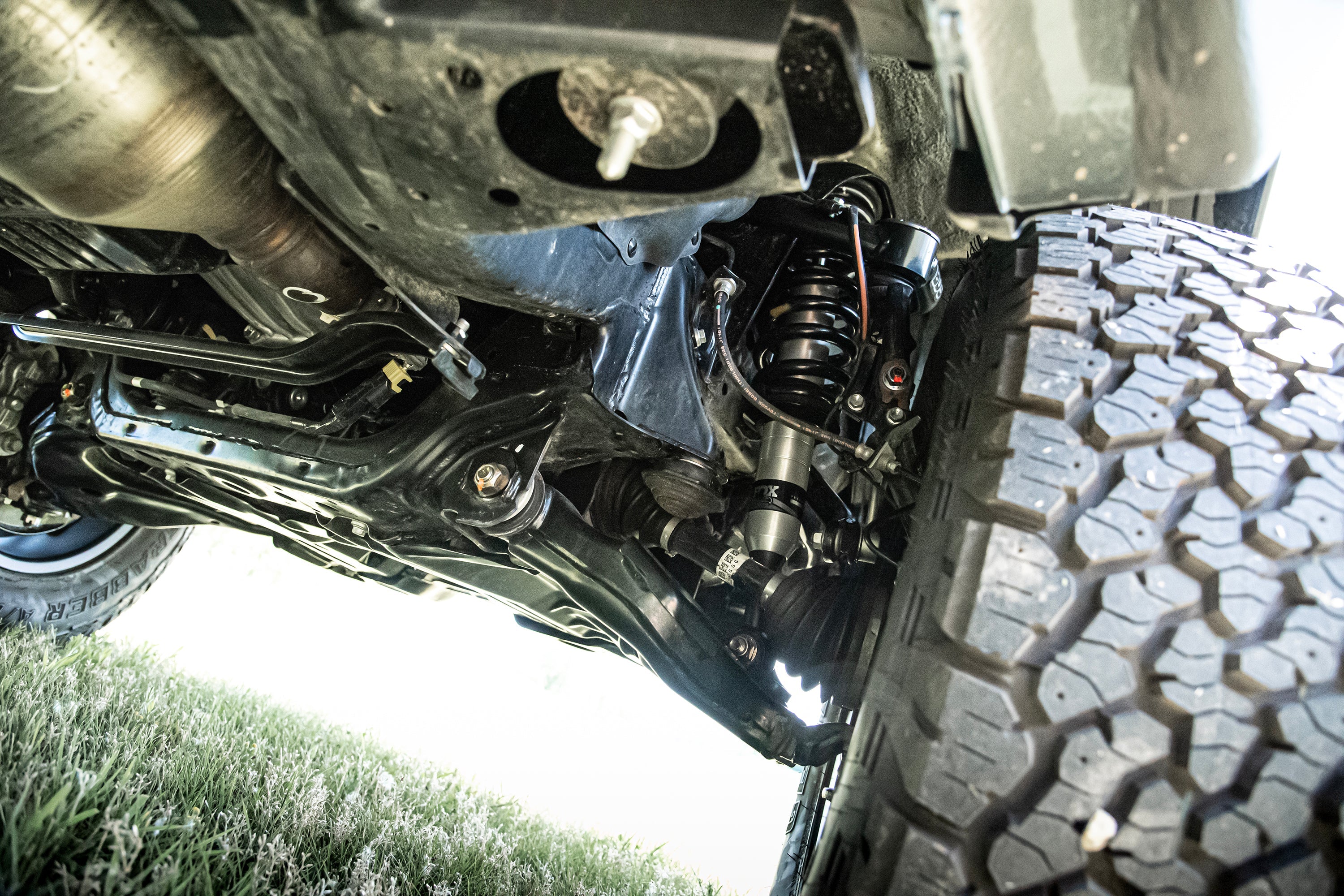 2 Inch lift kit featuring FOX coil-overs installed on a Toyota Hilux, showcasing enhanced suspension and off-road capability.