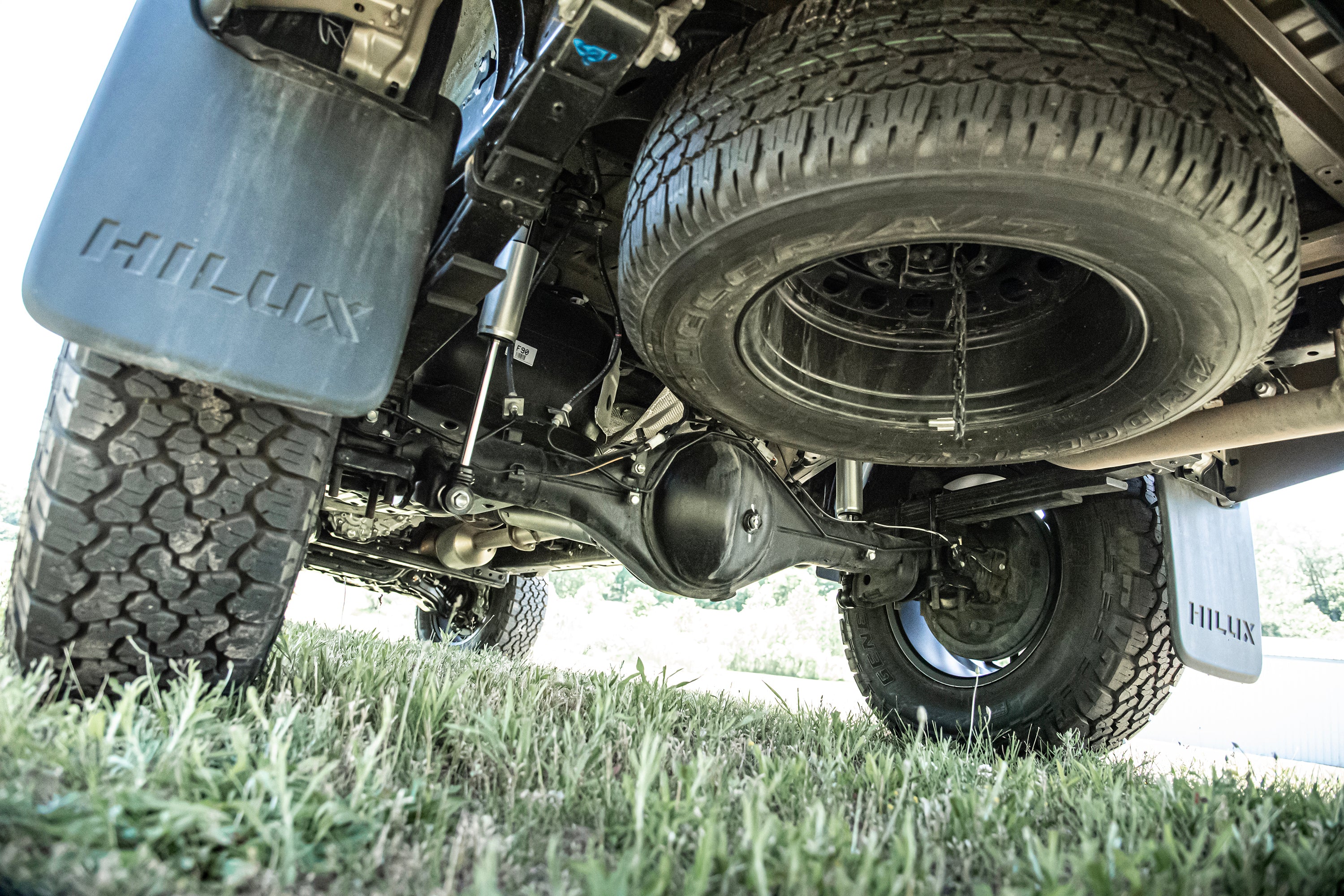 2 Inch lift kit with FOX coil-overs installed on a Toyota Hilux, showcasing enhanced suspension and off-road capability.