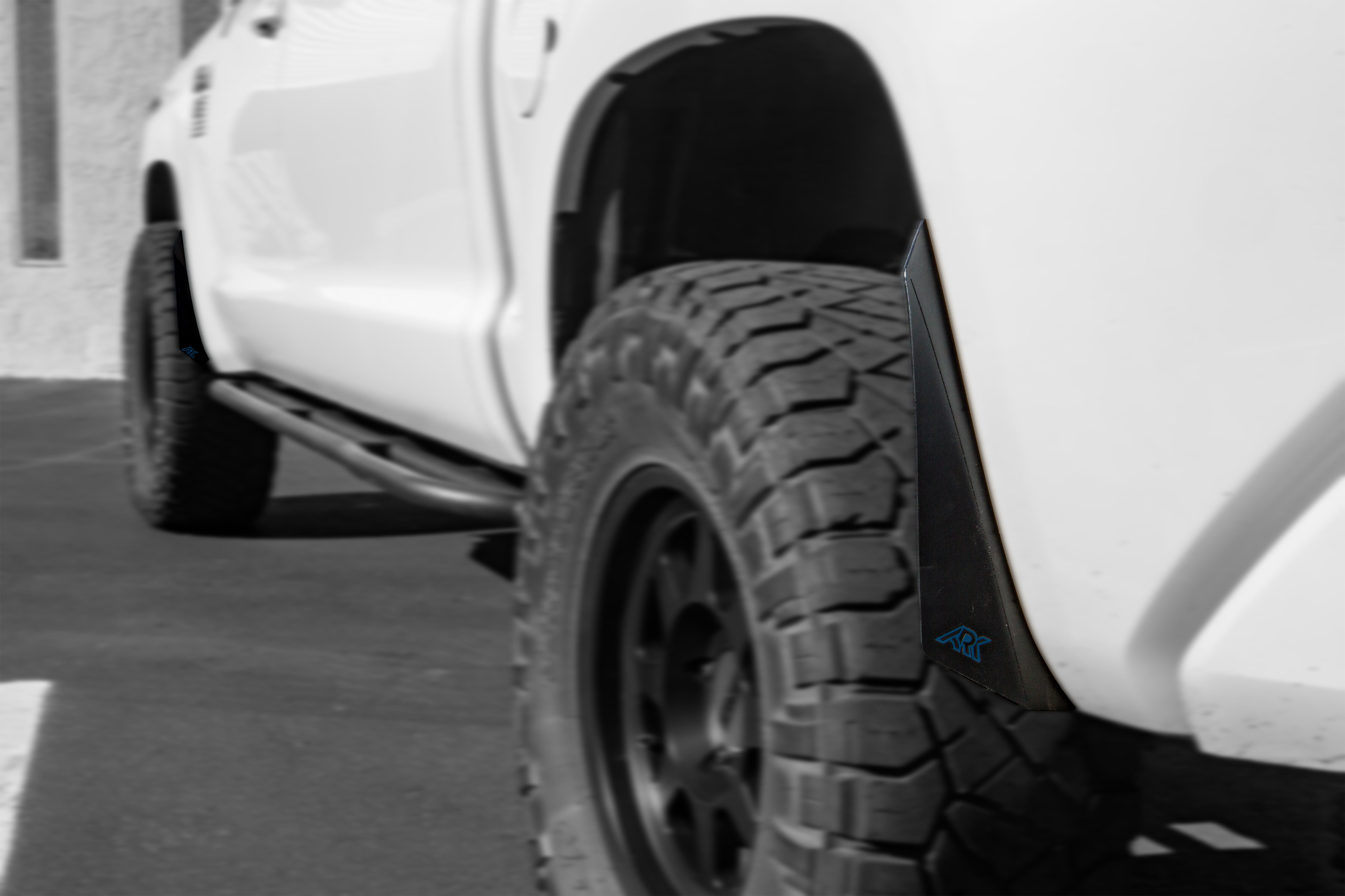 2007-2021 Toyota Tundra TriXpoly Micro Flares installed on a white truck, enhancing its rugged appearance and tire coverage.