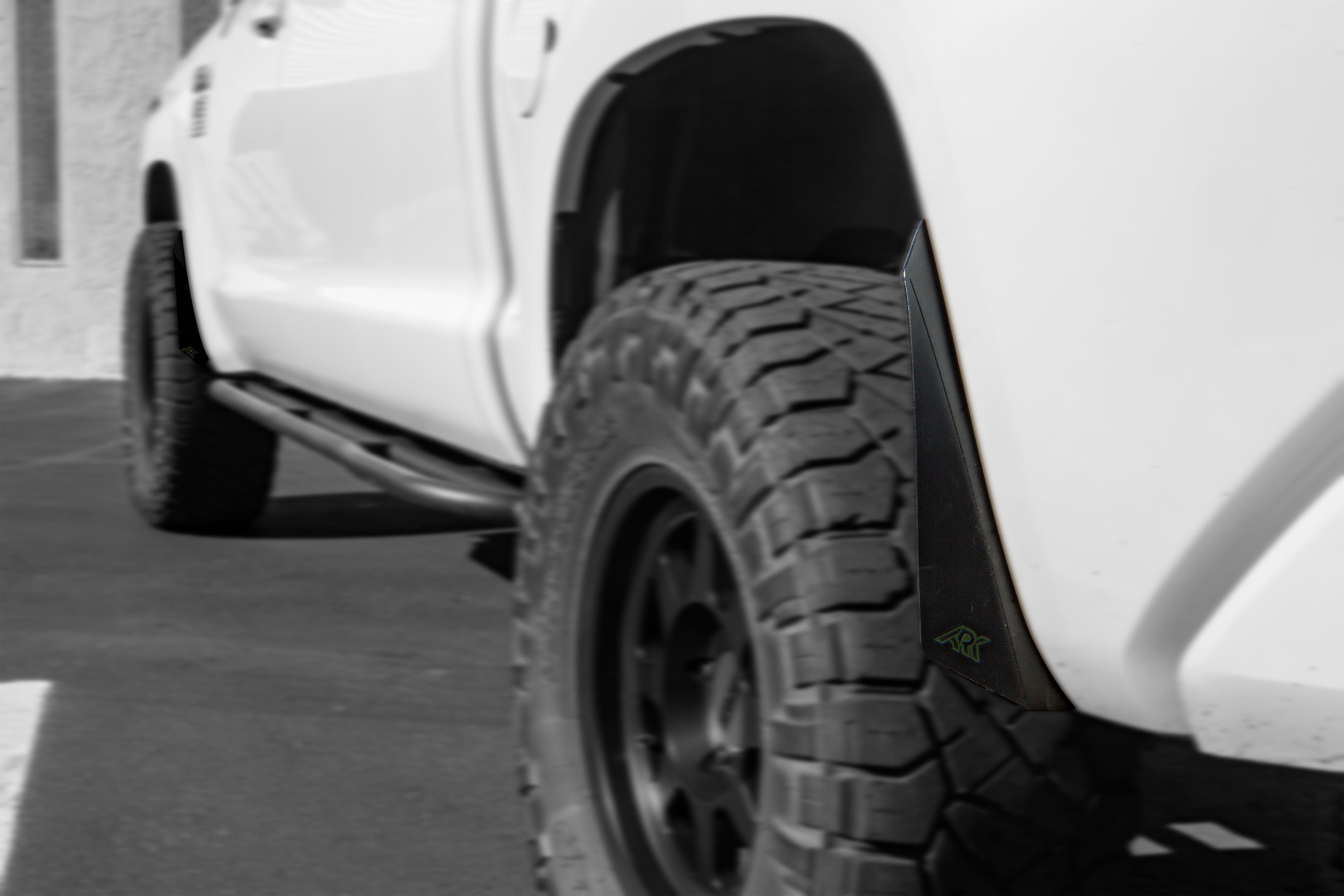 2007-2021 Toyota Tundra TriXpoly Micro Flares on a lifted truck tire, enhancing off-road style and protection.