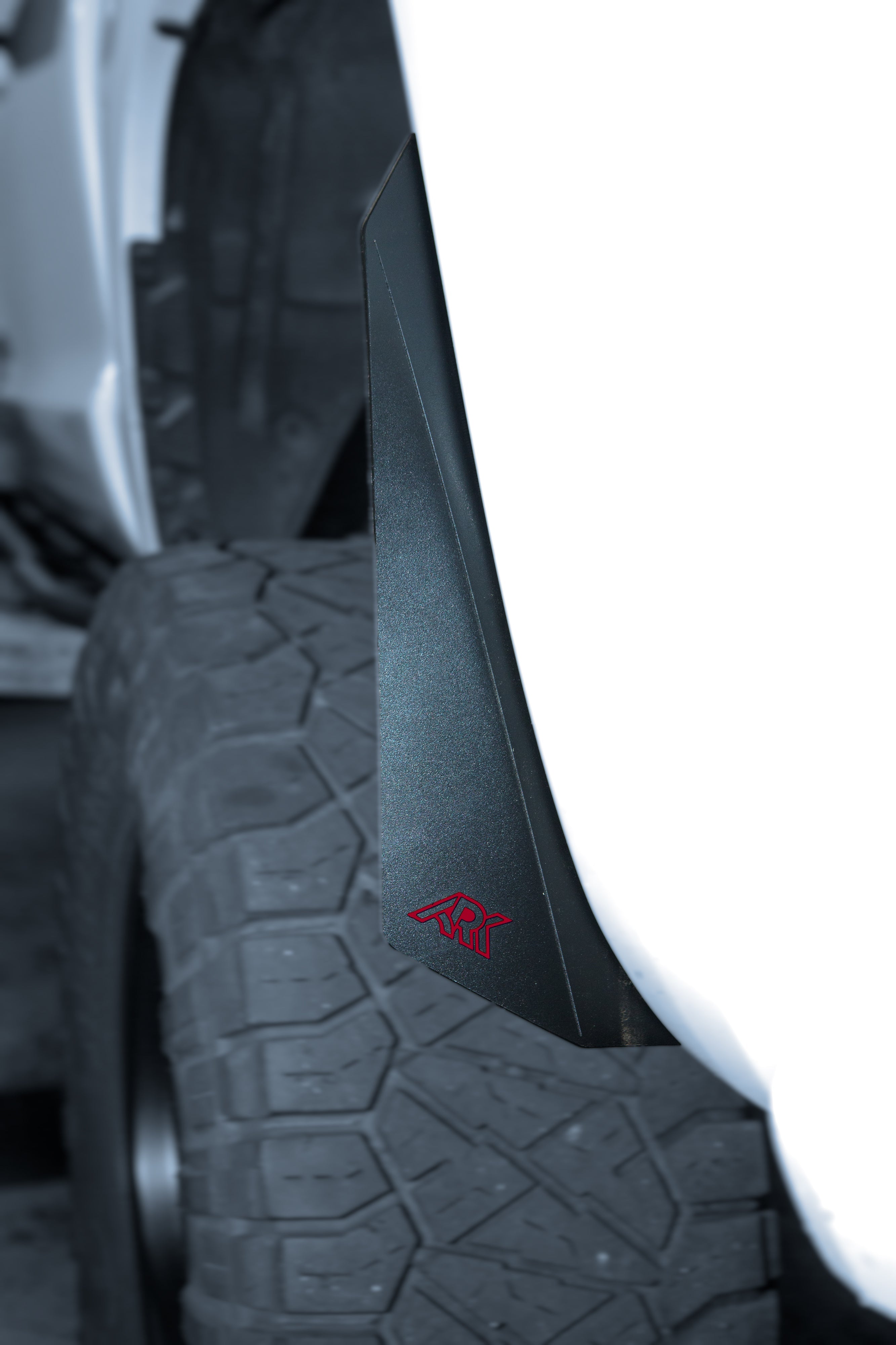 2007-2021 Toyota Tundra TriXpoly Micro Flares mounted on a tire, enhancing off-road performance and style.