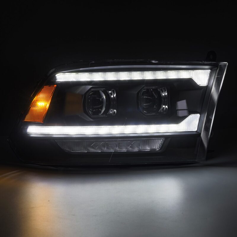 AlphaRex PRO-Series projector headlights for 09-18 Ram 1500/2500 with black housing, sequential signals, and DRL.