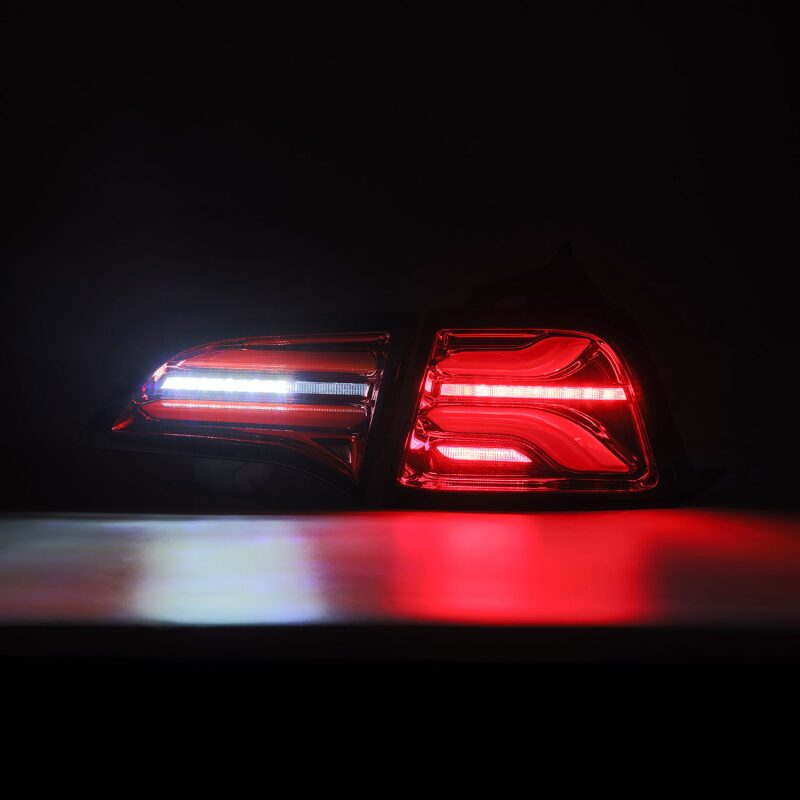 AlphaRex PRO-Series LED tail lights for 2017-2022 Tesla Model 3 in red smoke with sequential signals.