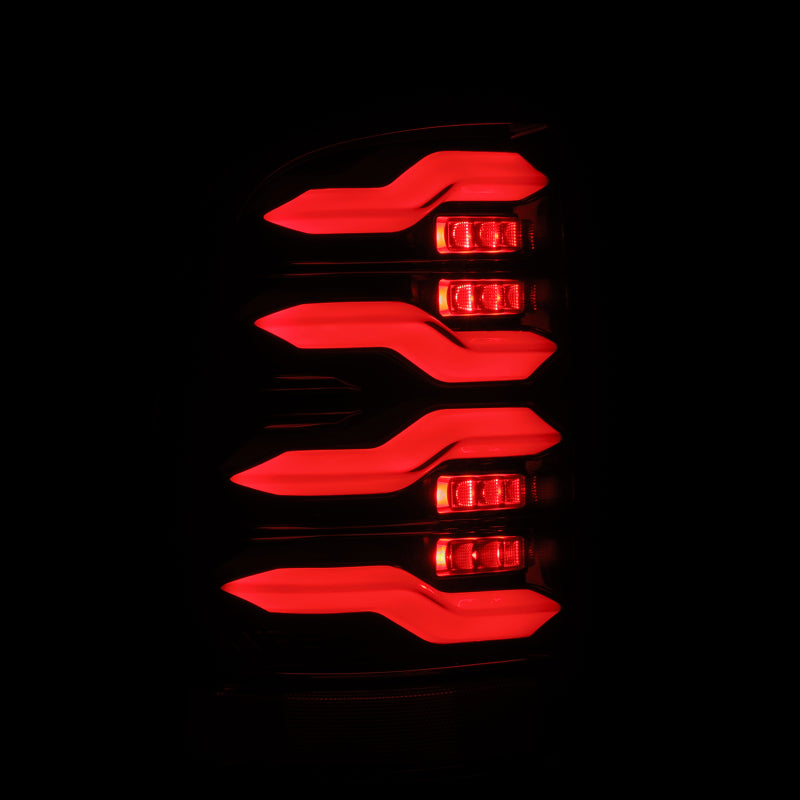 AlphaRex Luxx-Series LED tail lights for 09-18 Dodge Ram in alpha-black, featuring activation light and sequential signal.