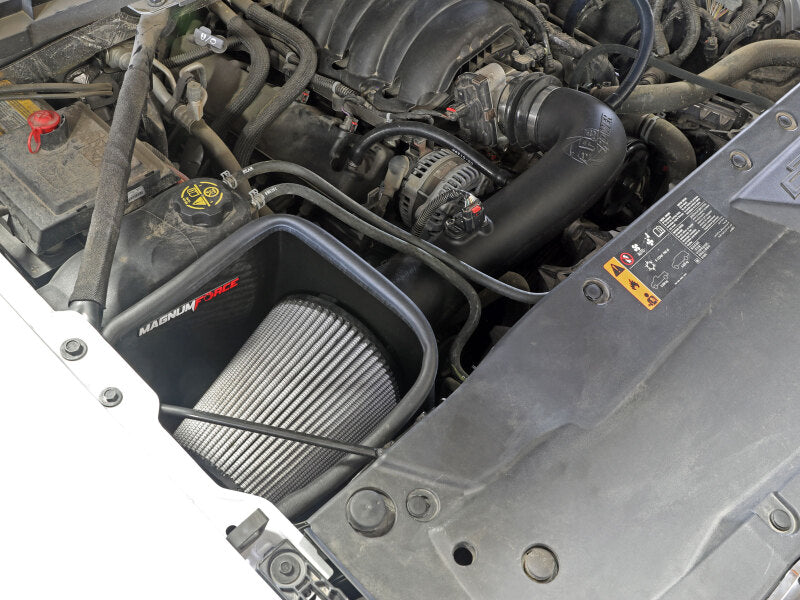 Open element intake system installed in a GM Silverado/Sierra 1500 engine bay, enhancing airflow for V8 models 2014-2019.