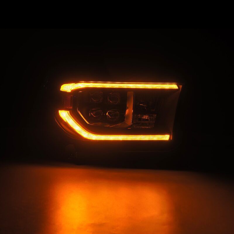 AlphaRex NOVA LED projector headlight for 07-13 Toyota Tundra and 08-17 Sequoia with black housing and sequential turn signals.