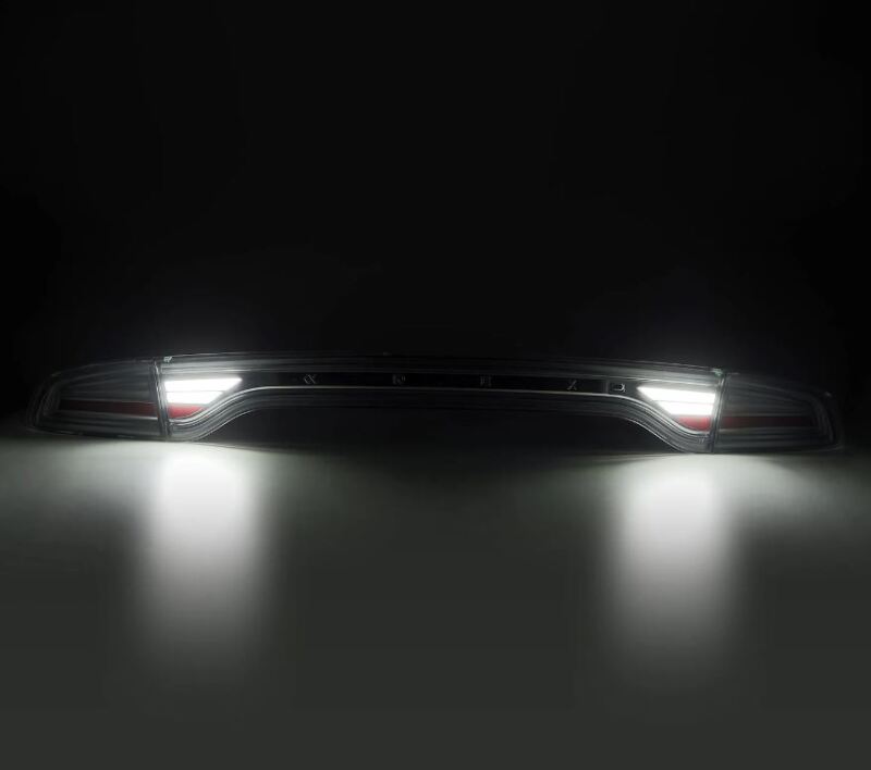 AlphaRex 15-23 Dodge Charger Nova-Series LED tail lights in smoke finish, showcasing sleek design and bright illumination.