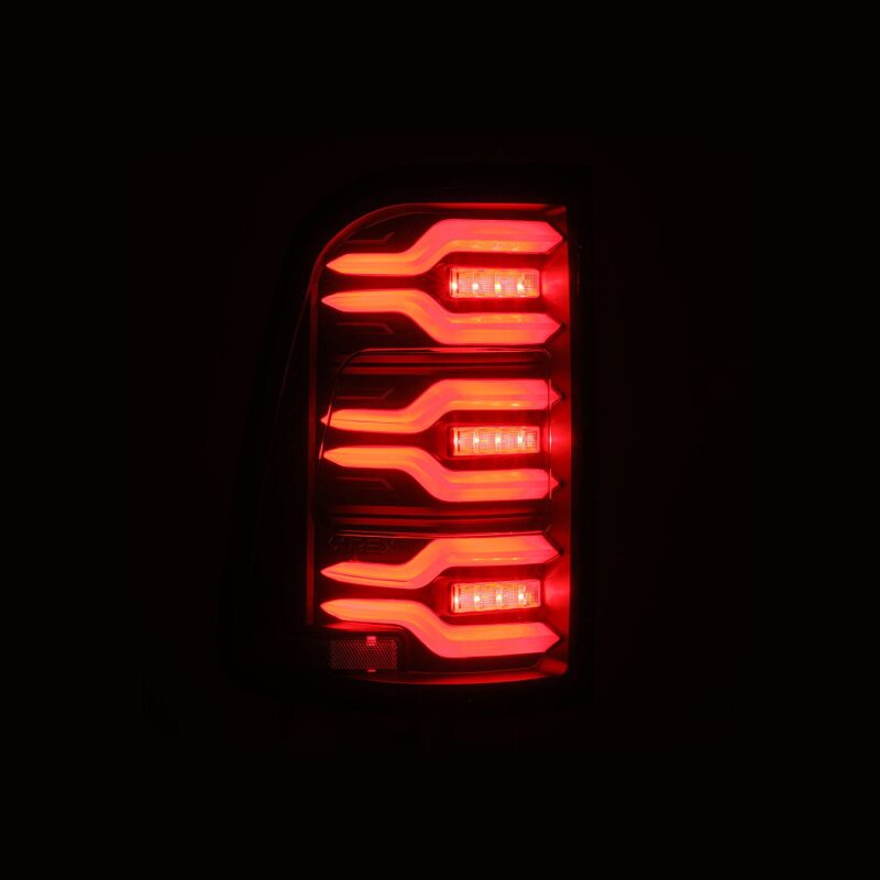 AlphaRex Luxx-Series LED tail lights for 19-21 Dodge Ram 1500 in black with sequential signal and active light features.