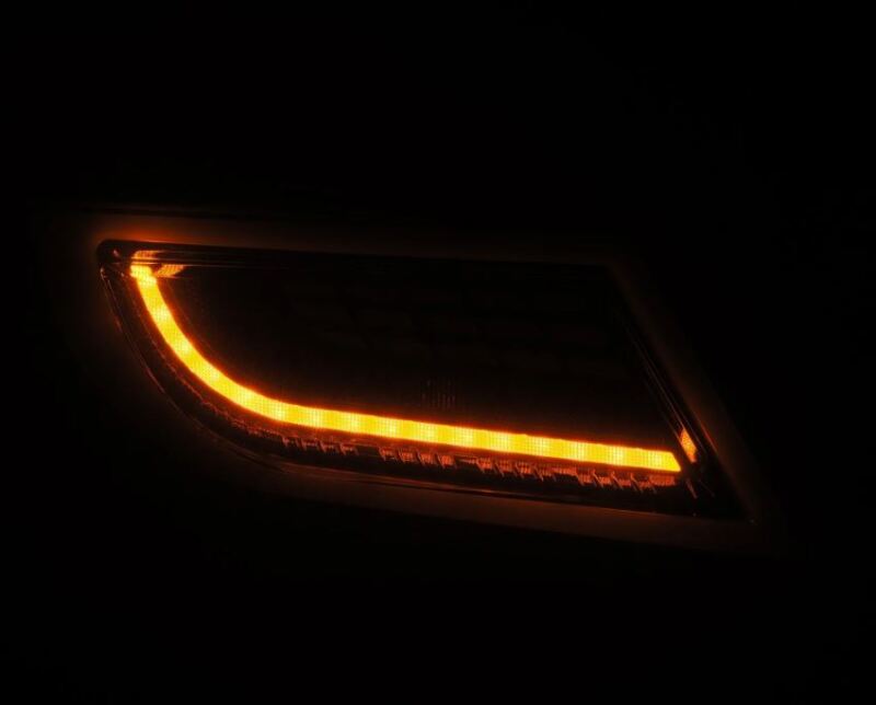 AlphaRex 22-24 Toyota GR86 LUXX LED taillight in black smoke with a glowing amber turn signal.