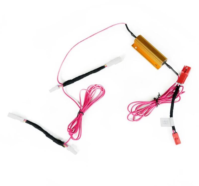 AlphaRex tail light converters for 2021 Tesla Model S Refresh, featuring wiring harness and connectors for installation.