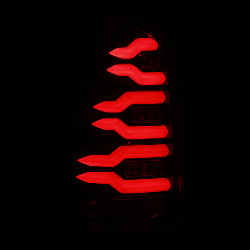 AlphaRex LUXX-Series LED tail lights for 03-09 Toyota 4Runner in black, featuring a sleek, modern design with bright red illumination.