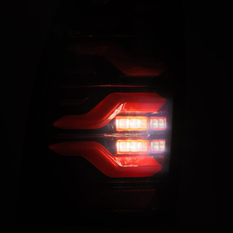 AlphaRex LUXX LED taillights for 05-15 Toyota Tacoma in black and red with sequential signal and active light features.