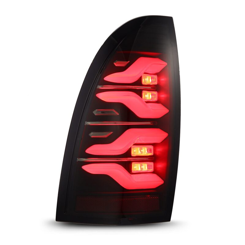 AlphaRex LUXX LED taillights for 05-15 Toyota Tacoma in black with sequential signal and active light features.