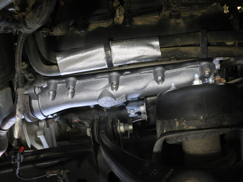 Afe BladeRunner exhaust manifold installed in a Dodge RAM 1500, showcasing its sleek design and durable construction.