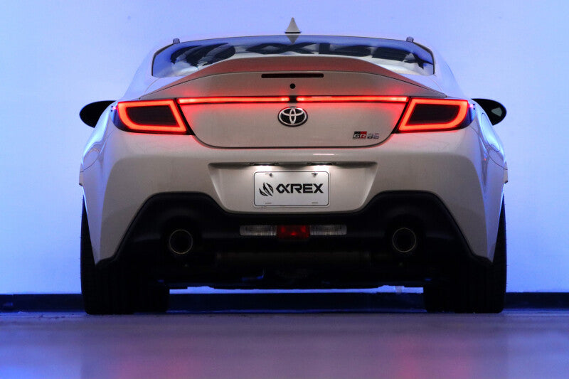 AlphaRex 22-24 Toyota GR86 LUXX LED trunk center light in vivid red, enhancing the rear visibility and style of the vehicle.