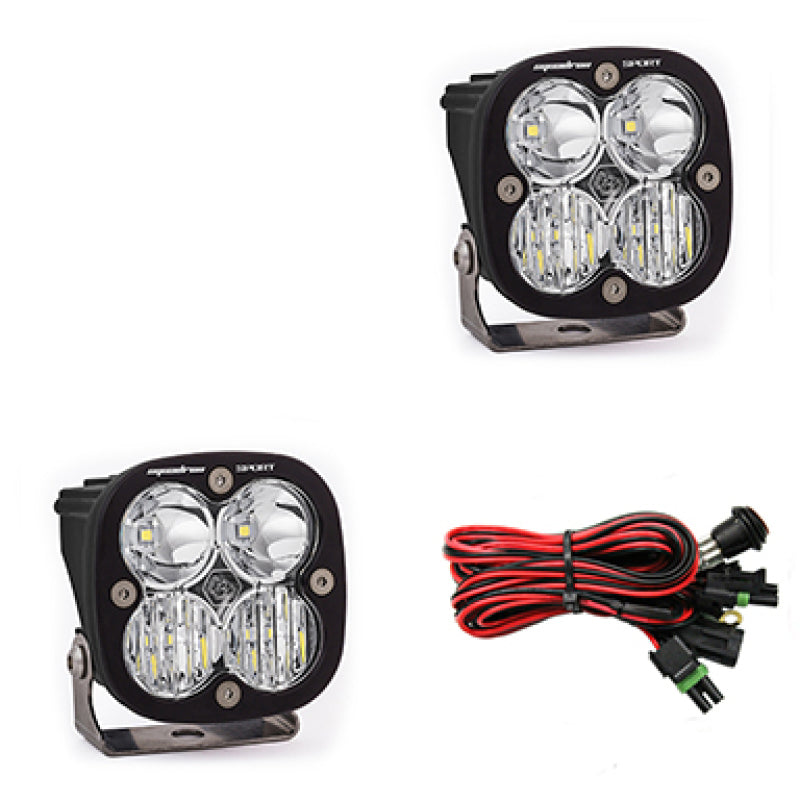 Baja Designs Squadron Sport LED light pods in clear, featuring dual lenses and wiring harness for off-road visibility.