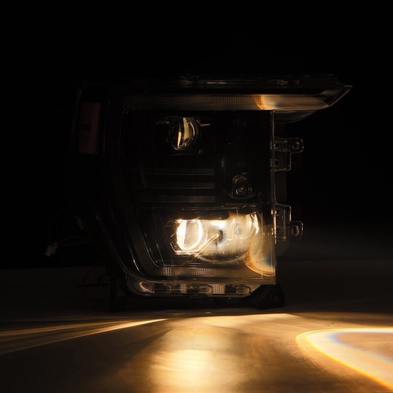 AlphaRex 21-22 Ford F150 PRO-Series projector headlights in black with active light and sequential signal features.