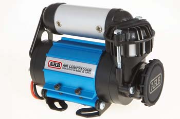 High-performance ARB 12-volt air compressor designed for off-road and overland applications, featuring a compact build.