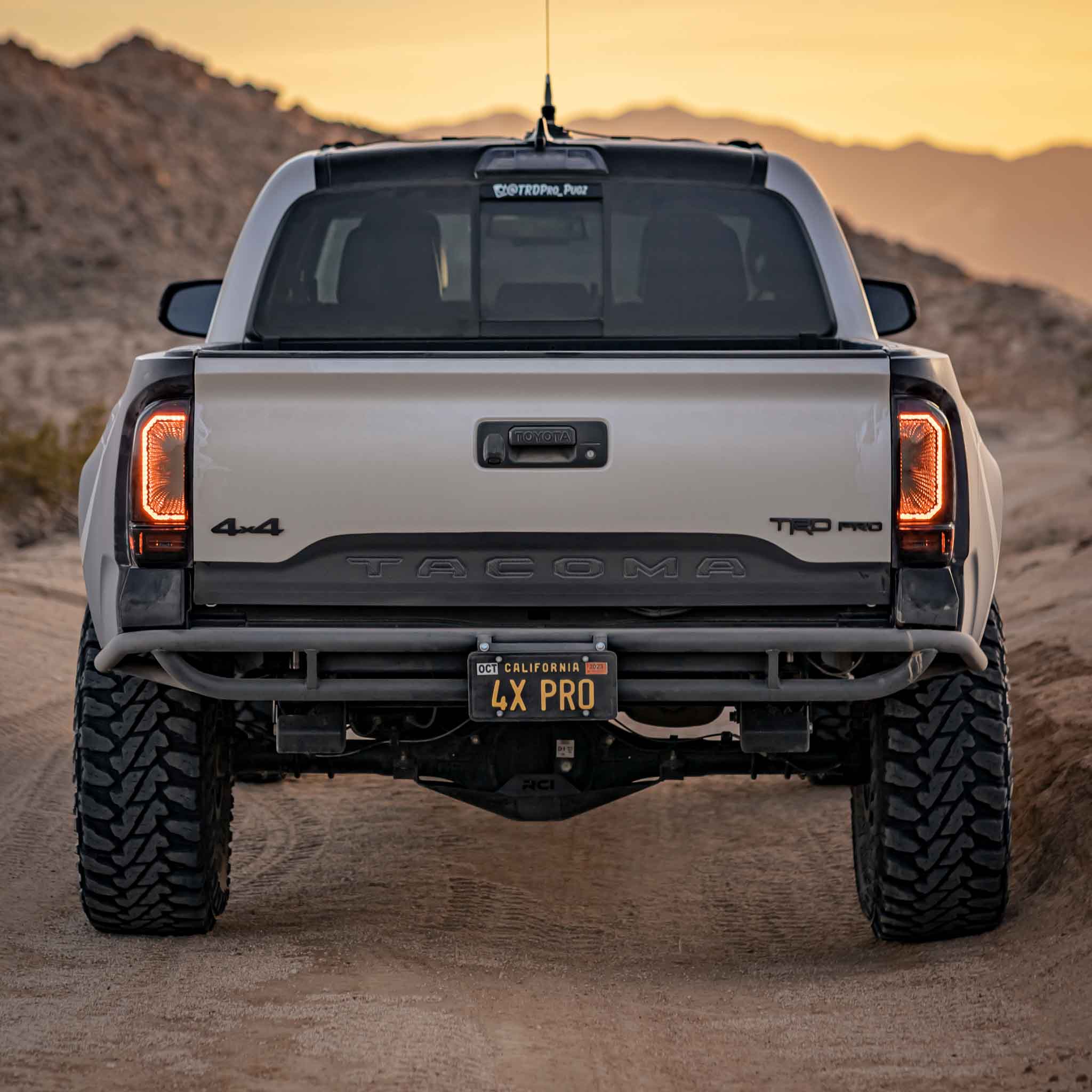 2016-2023 Toyota Tacoma bedsides showcasing a rugged off-road truck on a desert trail, emphasizing durability and style.