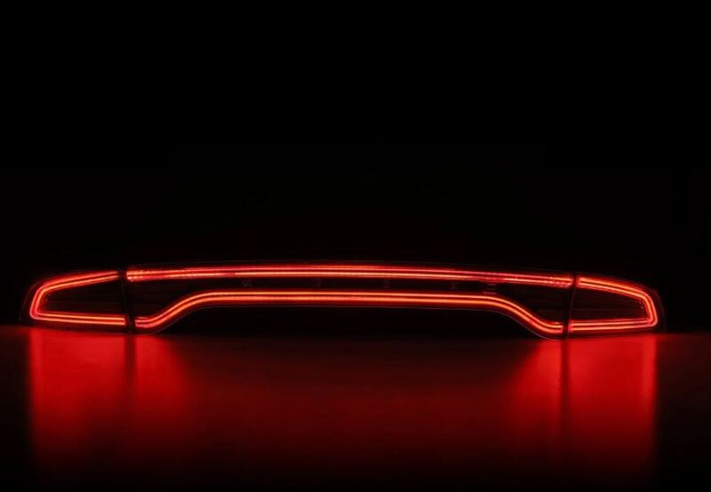 AlphaRex Nova-Series LED tail lights for 2015-2023 Dodge Charger in black, featuring a sleek red illumination design.