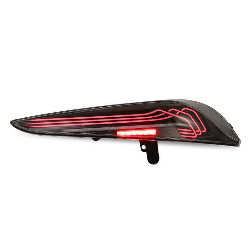 AlphaRex LUXX-Series LED tail light for 20-24 Toyota Supra, featuring a sleek black design and stylish laser-style illumination.