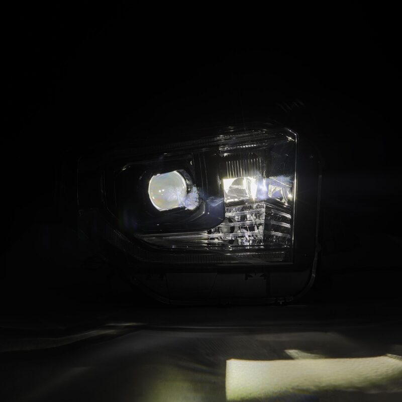 AlphaRex LUXX-Series LED projector headlights for 14-21 Toyota Tundra in black with active light and sequential signals.
