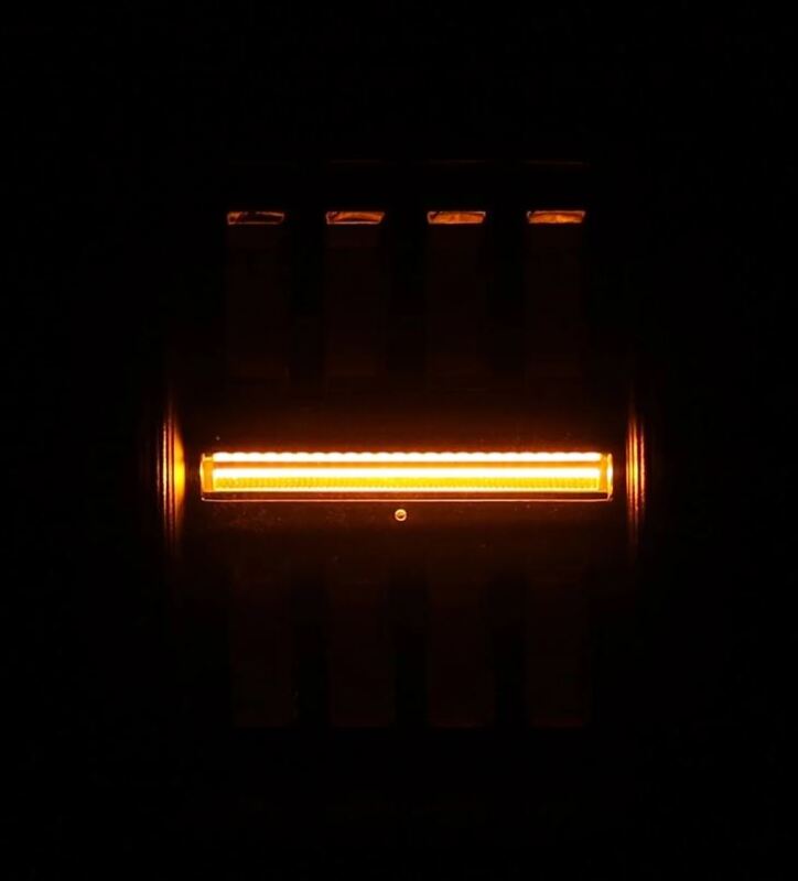 AlphaRex Jeep Gladiator JT Nova-Series LED tail light in black and red, featuring a prismatic design with an amber light.