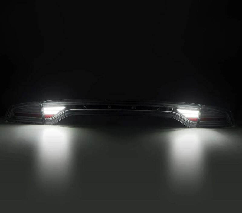 AlphaRex NOVA-Series prismatic LED tail lights for 2015-2023 Dodge Charger in smoke finish, showcasing bright illumination.