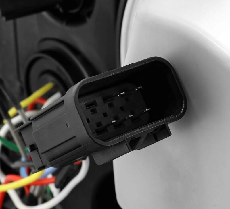 Close-up of the wiring connector for AlphaRex LUXX-Series headlights for 15-19 Chevy Silverado 2500/3500 models.