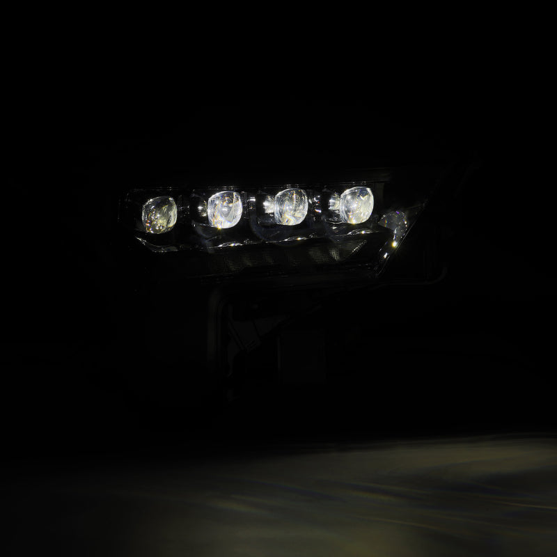 AlphaRex NOVA-Series headlights for 2022-2023 Toyota Tundra in alpha-black with amber daytime running lights.