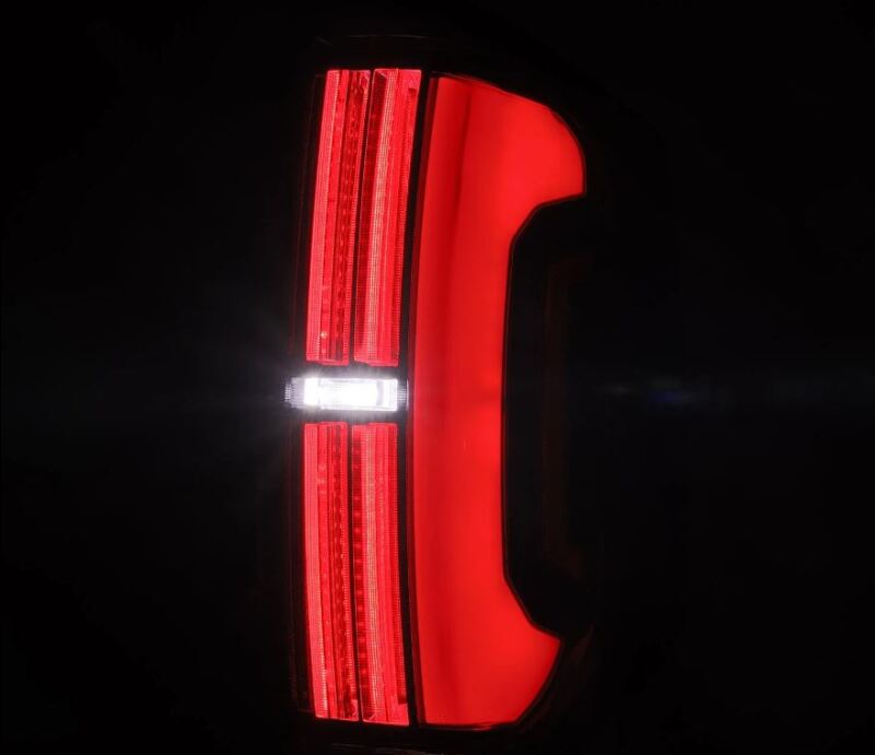AlphaRex LED tail lights for 14-21 Toyota Tundra in alpha-black, featuring a sleek design with bright red and white LEDs.
