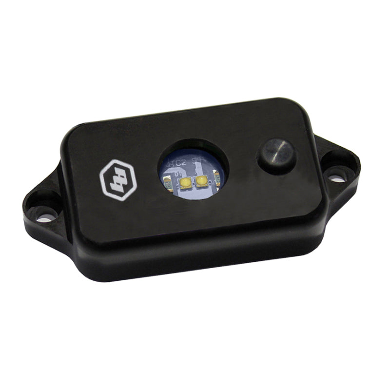 Baja Designs LED dome light with switch in red, featuring a compact black housing and a clear lens for illumination.