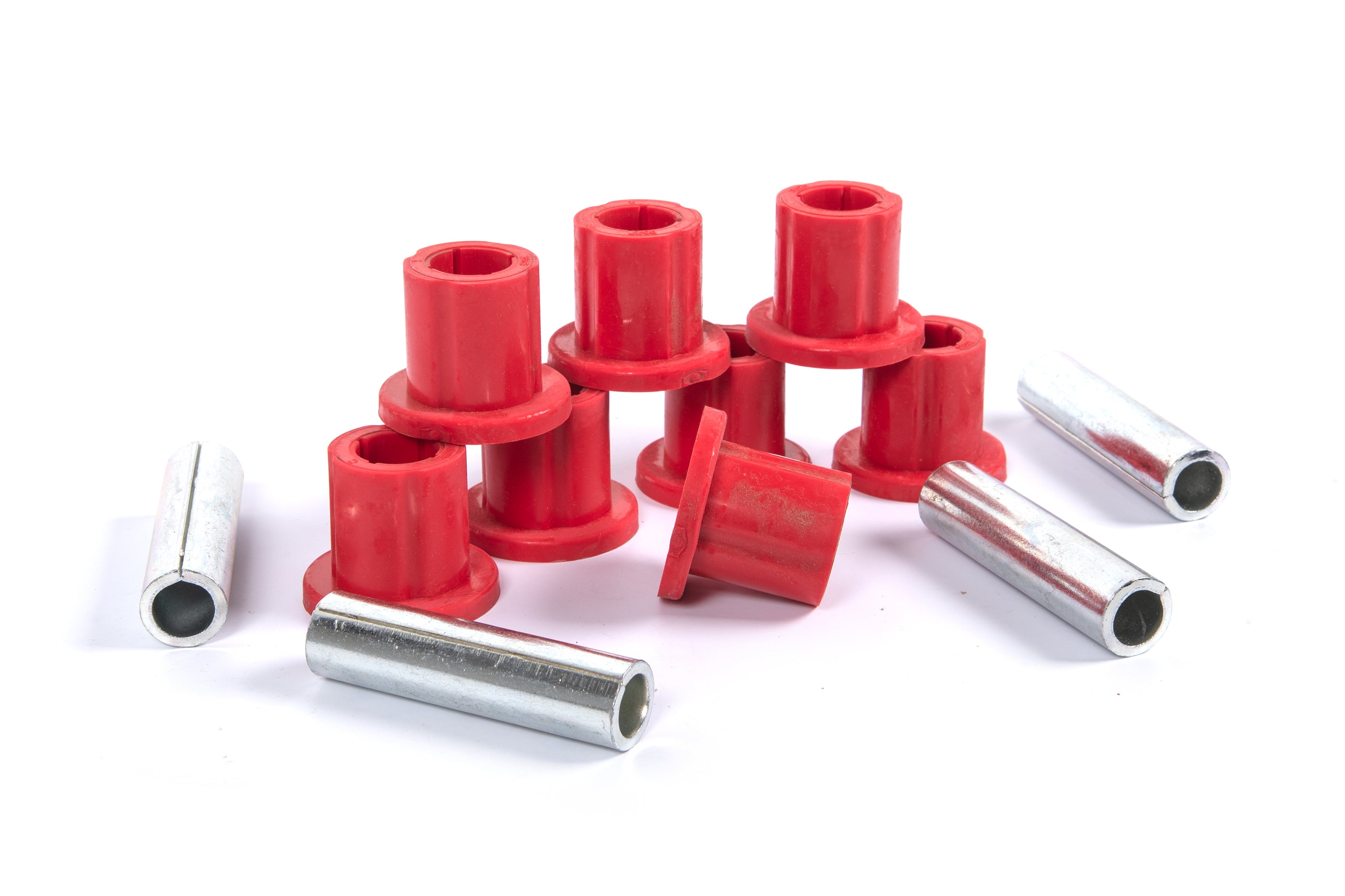 Bushing kit for Jeep Wrangler YJ (87-95) featuring red bushings and metal sleeves for frame shackle replacement.