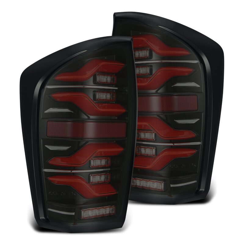 AlphaRex LUXX LED taillights for 2016-2021 Toyota Tacoma in black and red with sequential signal and activation light.