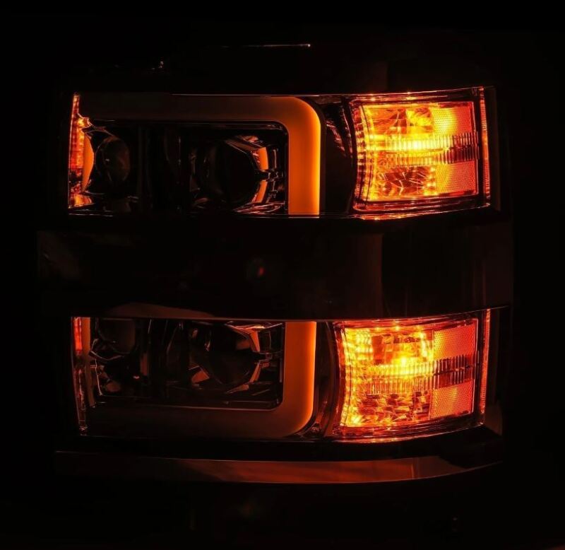 AlphaRex LUXX-Series projector headlights for 15-19 Chevy Silverado 2500/3500 with chrome finish, sequential signals, and DRL.