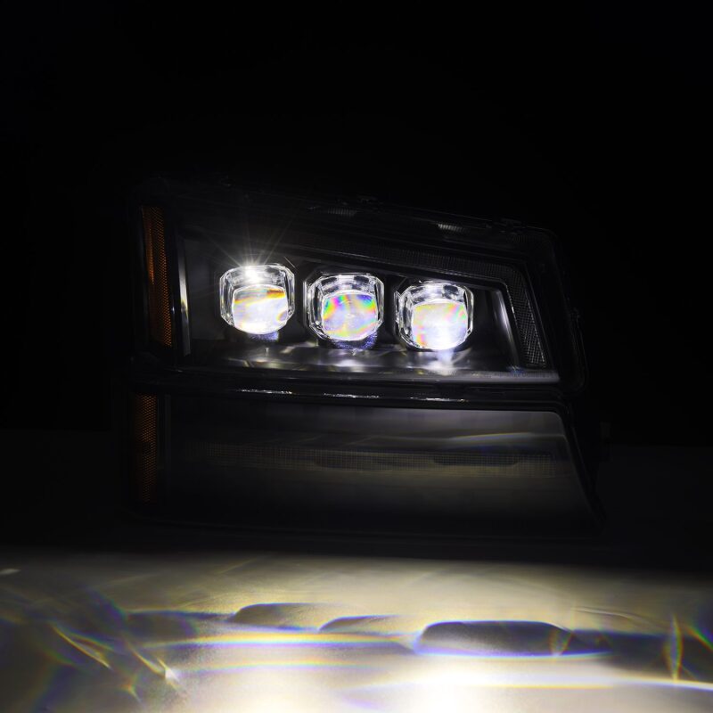AlphaRex Black NOVA LED projector headlights for 03-06 Chevy Silverado and Avalanche, showcasing bright, modern design.