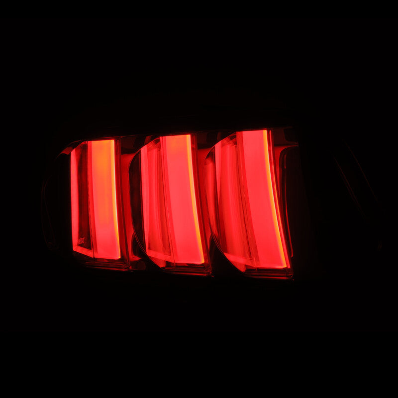AlphaRex NOVA-Series prismatic LED tail lights for 2015-2023 Ford Mustang in Alpha-Black finish, showcasing vibrant red illumination.