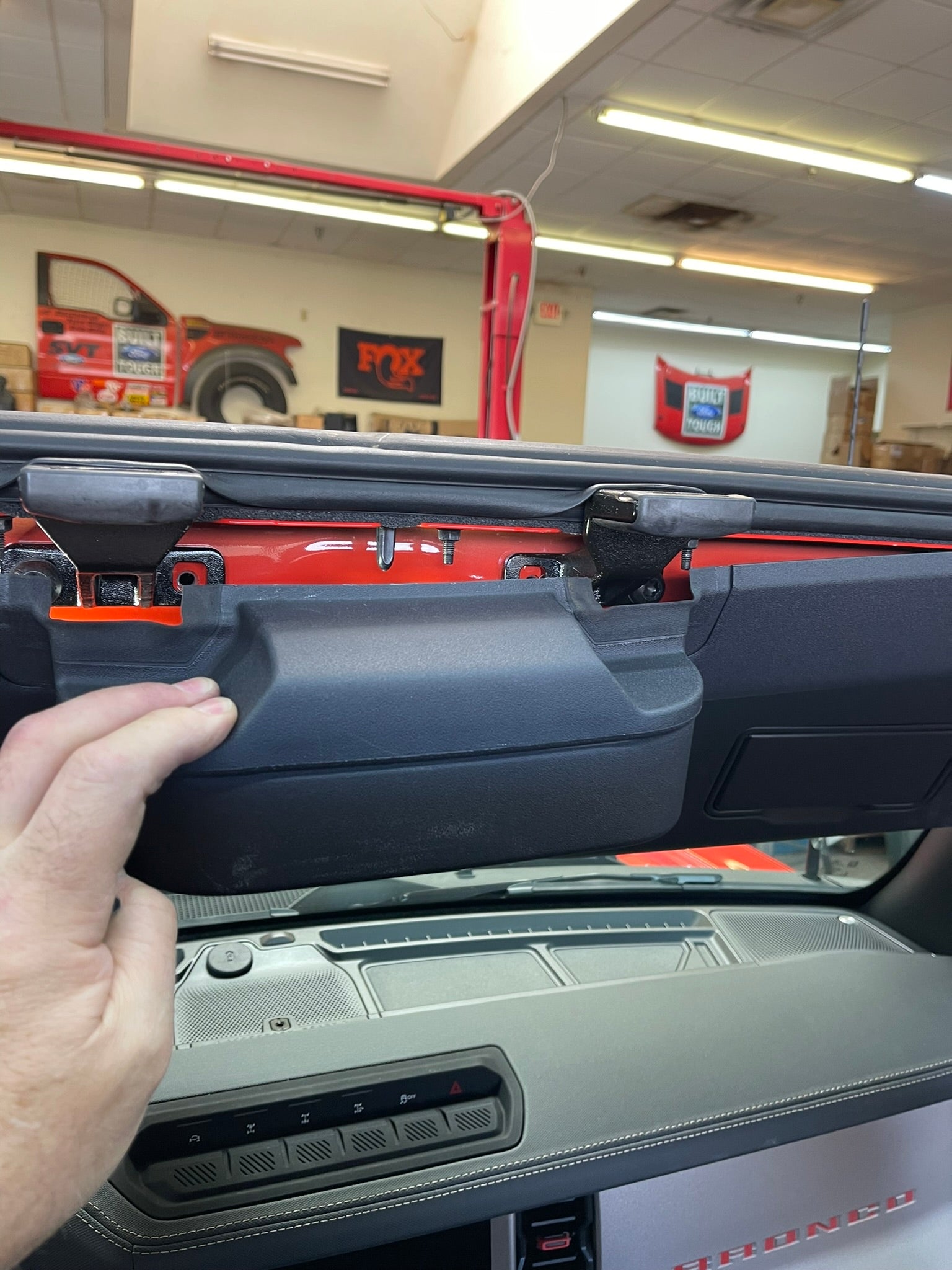 Inside view of a 2022 Bronco Raptor featuring the Adapt-A-Panel short front roof mount add-on for enhanced utility.