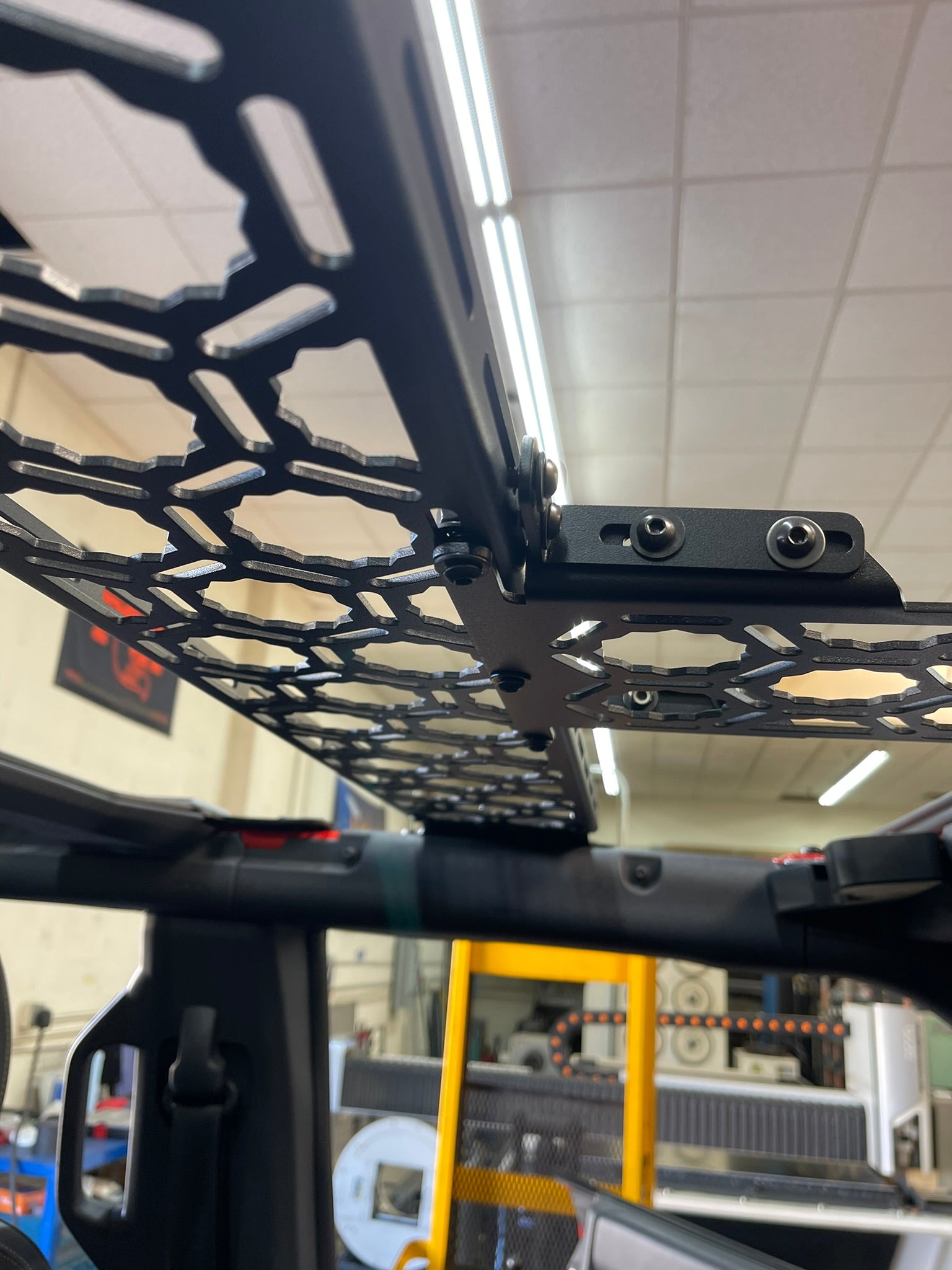 Inside view of the Bronco Raptor 2022 roof mount with a short panel add-on, showcasing its sturdy design and installation points.