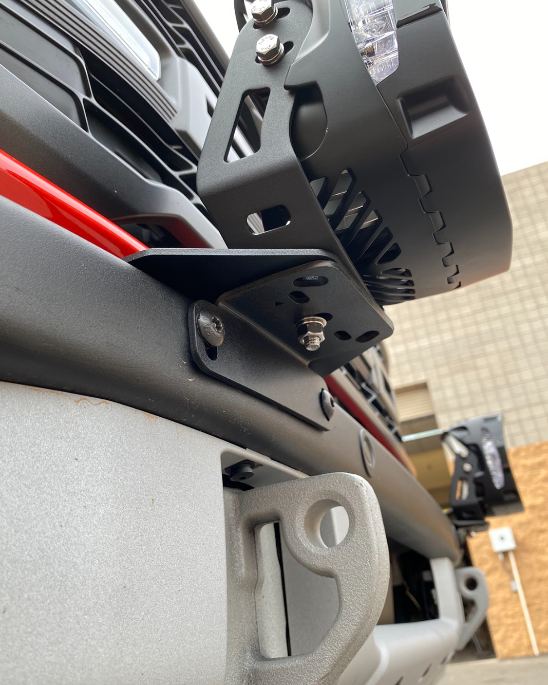 Light mount brackets for 2022-2024 Bronco Raptor's stock modular bumper, showcasing durable metal construction and installation details.
