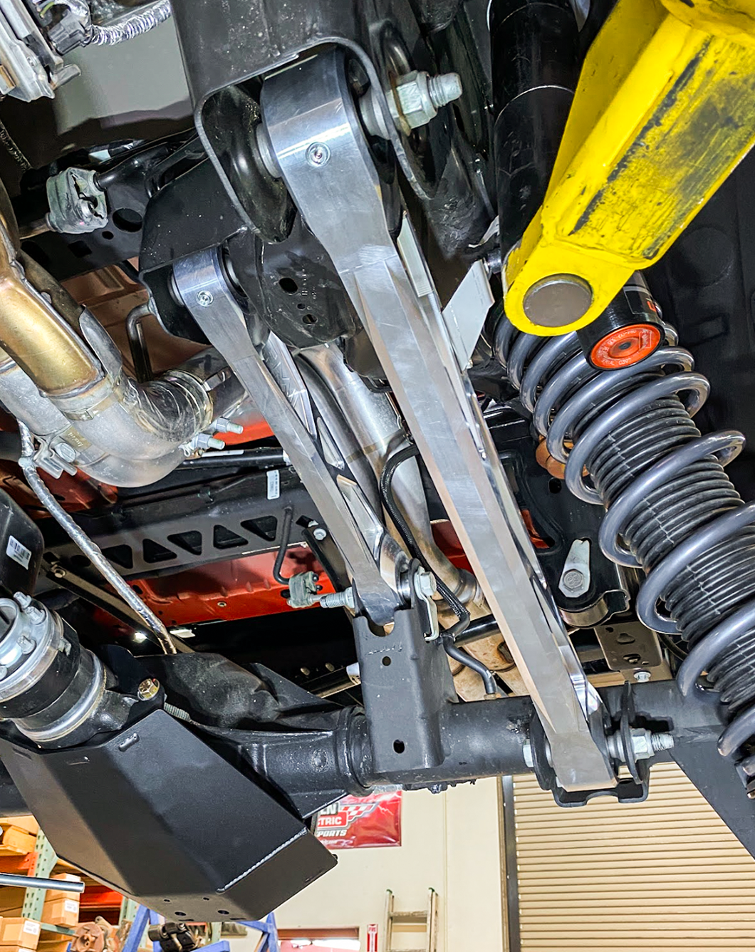 Billet aluminum rear suspension arms with ultra-flex joints for 2022 Bronco Raptor, showcasing durability and performance.