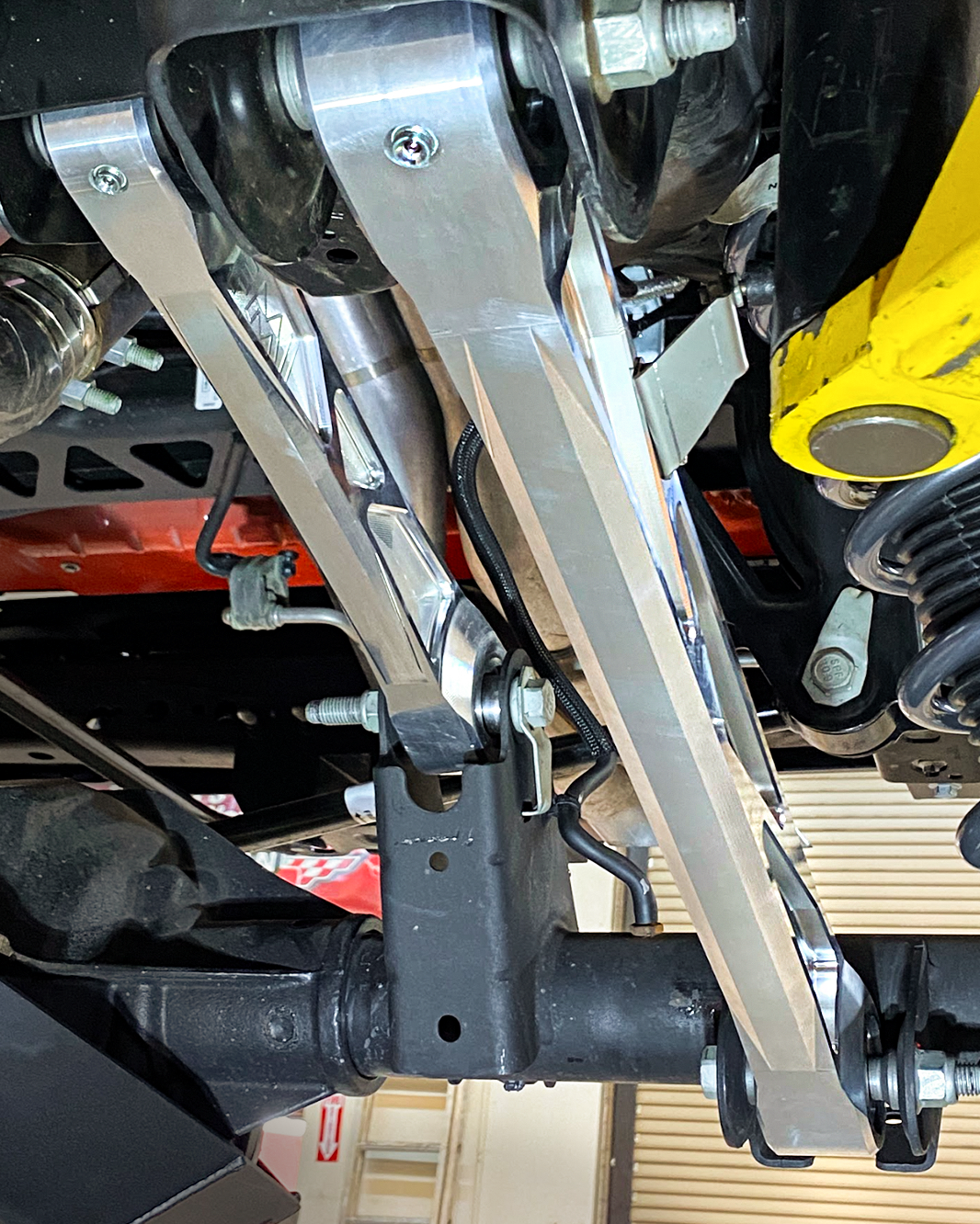 Billet aluminum rear suspension arms with ultra-flex joints installed on a 2022 Bronco Raptor, showcasing durability and performance.