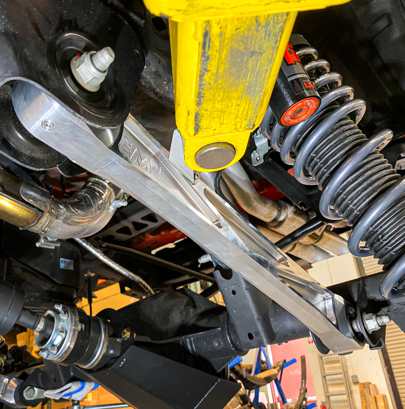 Billet aluminum rear lower suspension arms with ultra-flex joints for 2022 Bronco Raptor, showcasing durable design and performance.